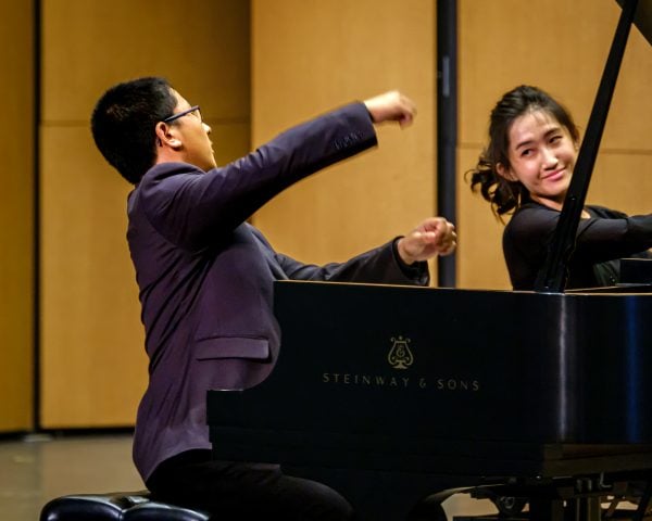 two pianists, including a solo pianist accompanied by a collaborative pianist